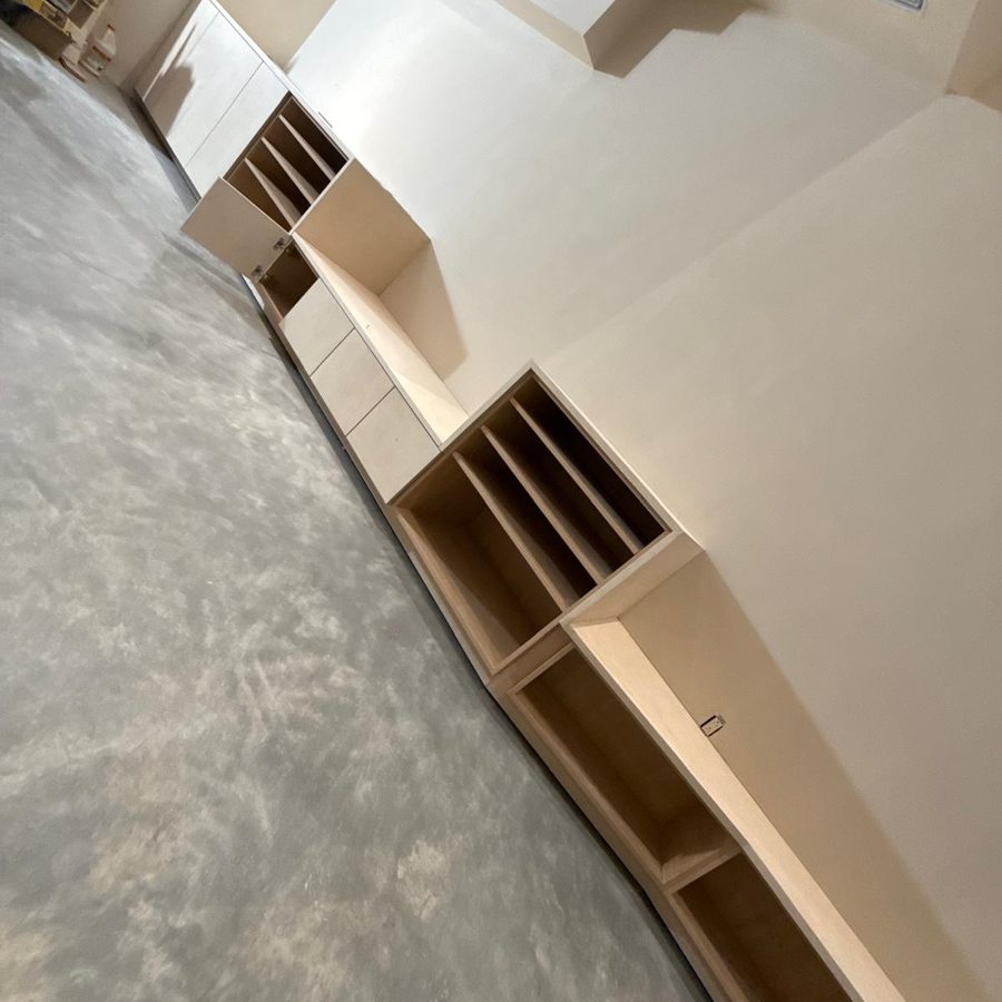 Open shelving and drawers of the basement built-ins from a low angle