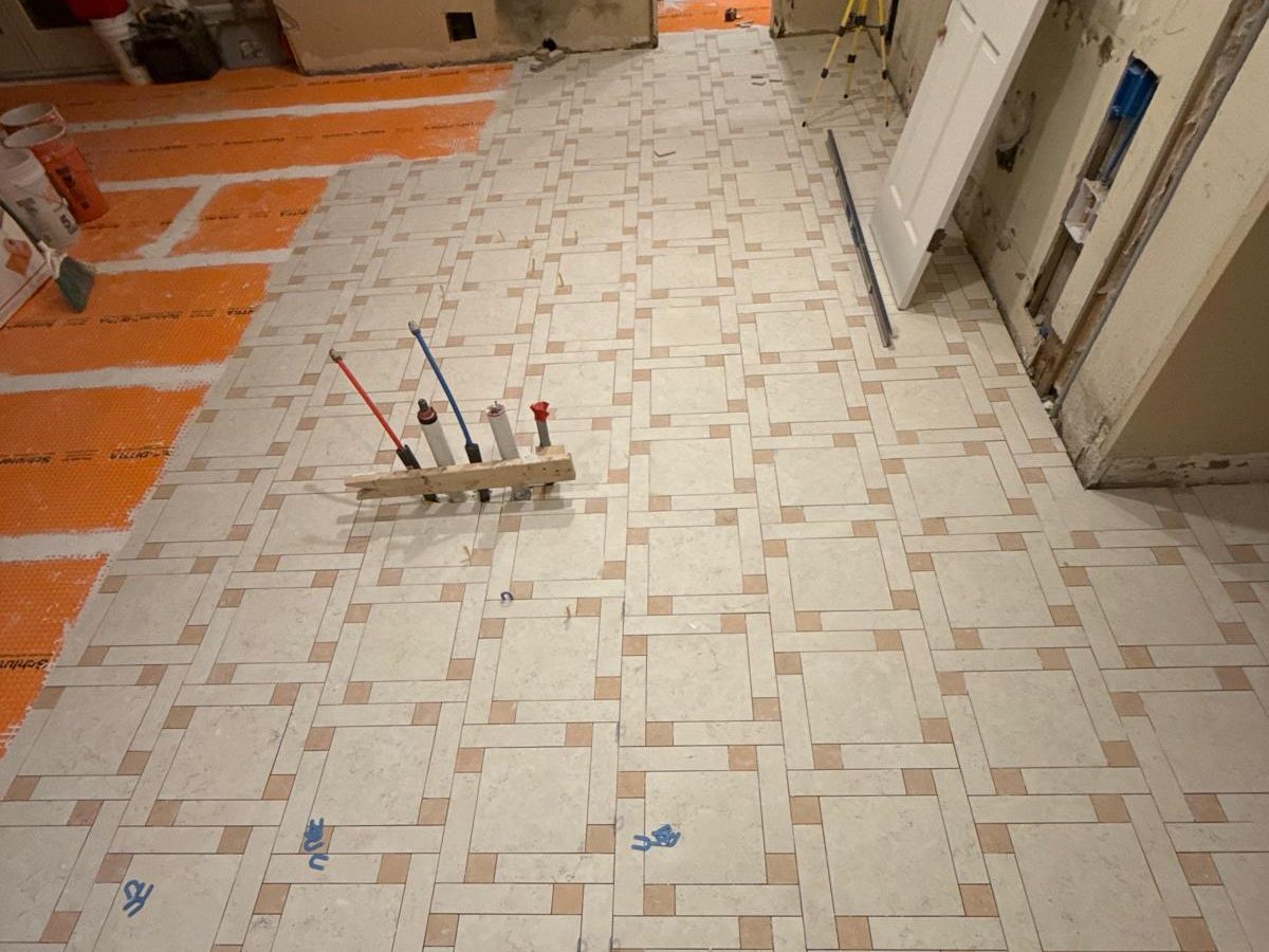 Close view of the woven porcelain floor pattern during installation