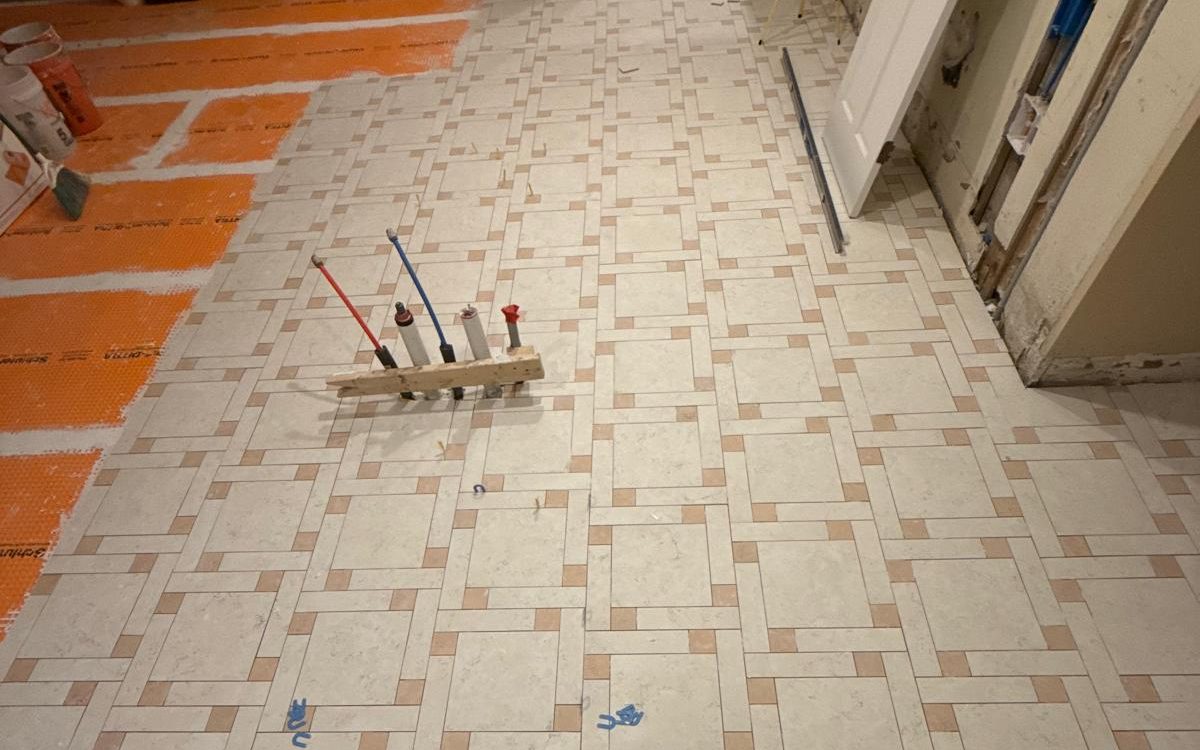 Close view of the woven porcelain floor pattern during installation