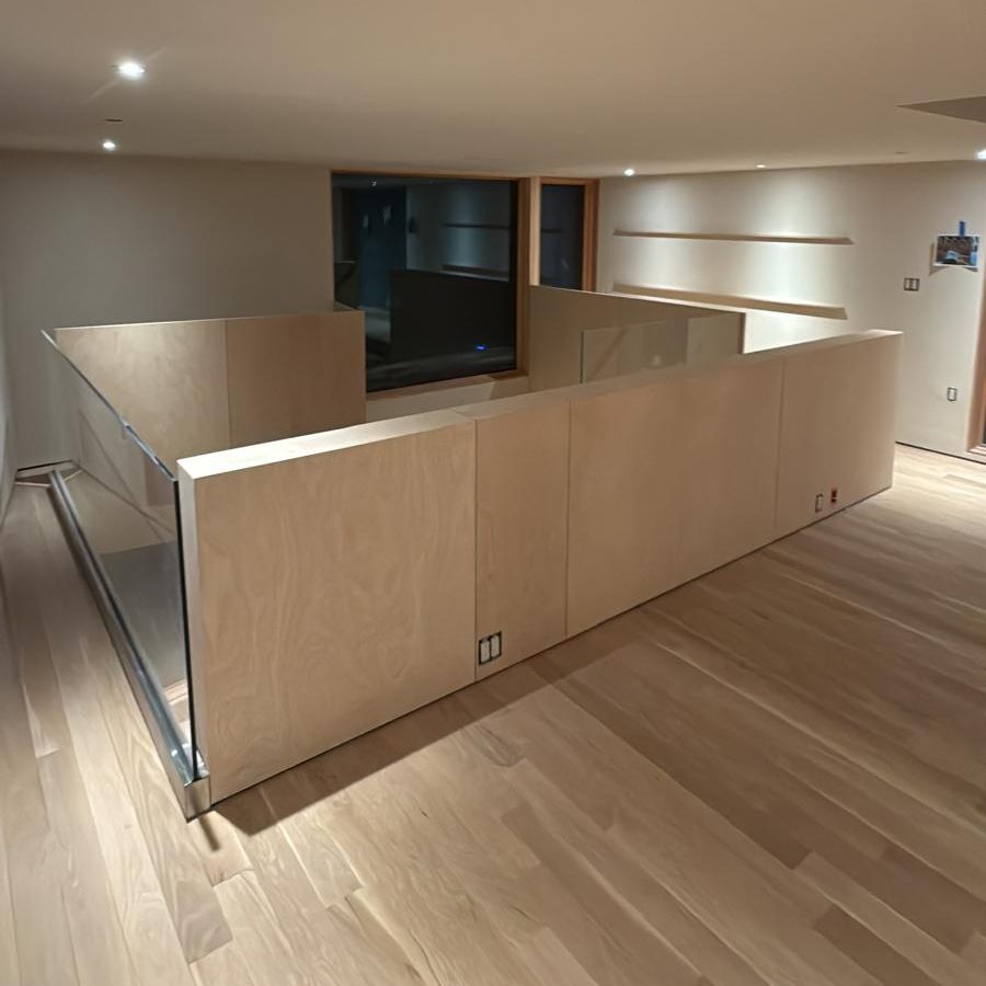 Birch plywood guard wall around the stair opening on the upper floor