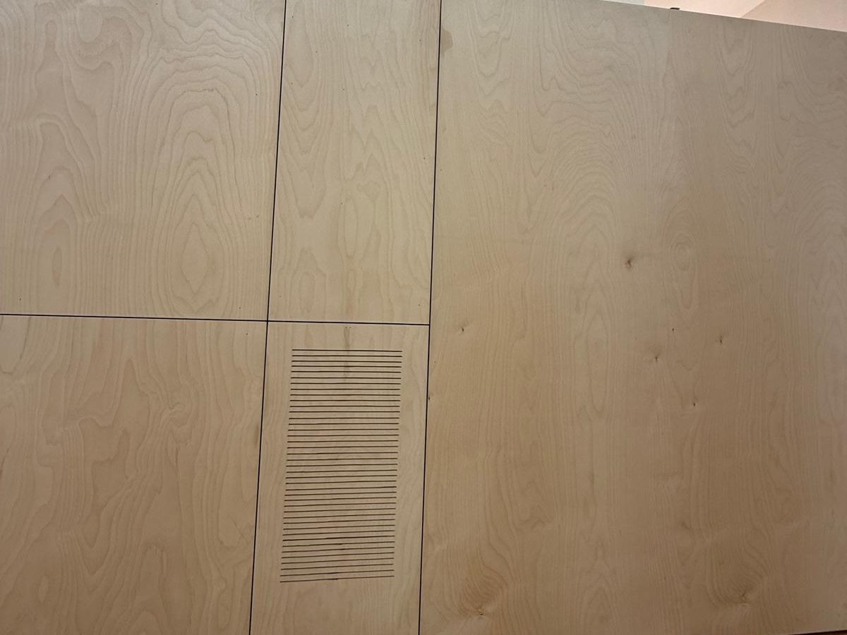 Birch plywood panels with tight reveals and a slotted vent panel
