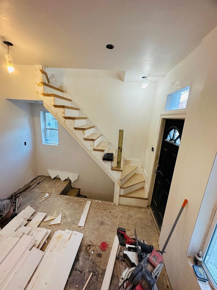 New stair with oak treads built beside the front entry door